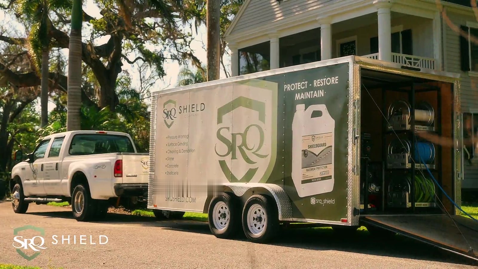 SRQ Shield truck and branded trailer parked at a Bradenton home